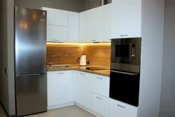 Corner kitchen design photo in modern style