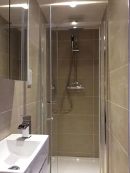 Design of a narrow bathroom with toilet and shower