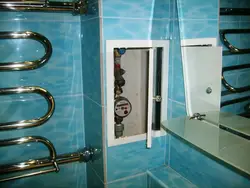 Photo of pipes on the bathroom wall