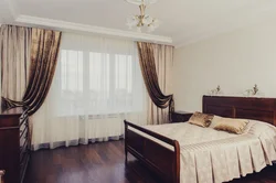 One curtain in the bedroom interior photo