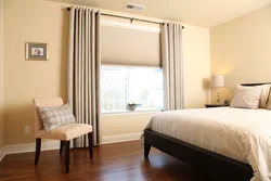 One curtain in the bedroom interior photo