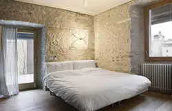 Bedroom with decorative plaster on the walls in the interior