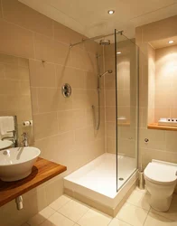 Combined bathroom with bath and shower photo