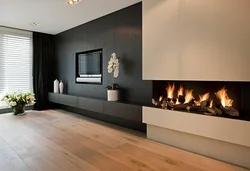 Photo of a fireplace in an apartment with a TV in a modern style