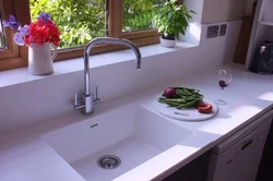 Countertop made of artificial stone for the kitchen photo with sink