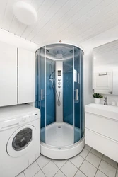 Photo of small bathrooms with shower and washing machine