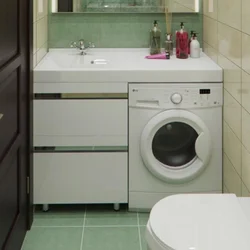 Photo Of The Sink Above The Washing Machine In The Bathroom
