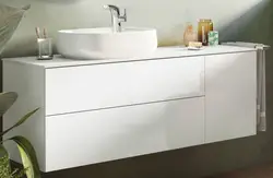 Washbasin in the bathroom with cabinet photo