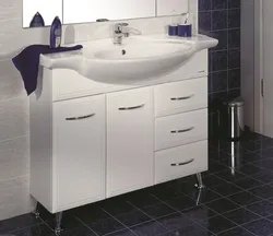 Washbasin In The Bathroom With Cabinet Photo