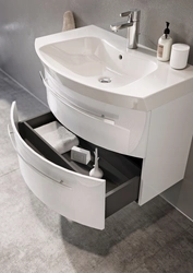 Washbasin in the bathroom with cabinet photo