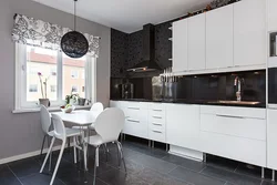 White kitchen design with dark countertops