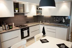 White Kitchen Design With Dark Countertops