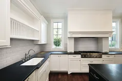 White kitchen design with dark countertops