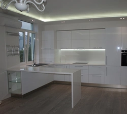Kitchen design in a modern style in light colors with bar