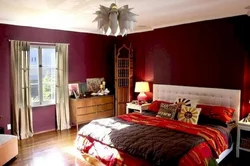 Photo of a bedroom in burgundy tones photo