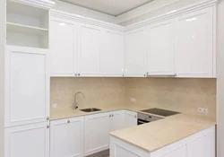Kitchens with white countertops and white sink photo