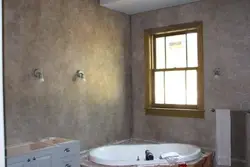 Photo of finishing a bathroom with decorative plaster