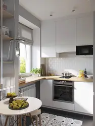 Kitchen in a small apartment photo with refrigerator design