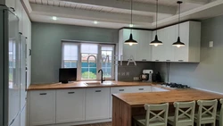 Kitchen with bar counter projects with photos in the house