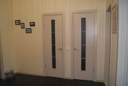 Doors to the bathroom and toilet in the interior photo