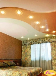 Two-level suspended ceilings with lighting in the bedroom photo design