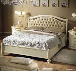 Photo of a bedroom with a soft headboard