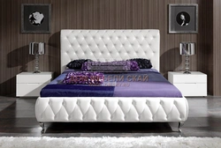 Photo Of A Bedroom With A Soft Headboard