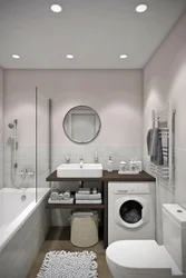 Bathroom with sink, toilet and washing machine photo