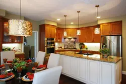 Photo Of A Kitchen In A House With A Chandelier