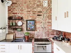 Kitchen design with bricks on the wall photo