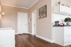 White doors in the interior of an apartment with floors