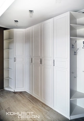 Wardrobe in the hallway with hinged doors in a modern style photo