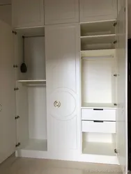 Wardrobe in the hallway with hinged doors in a modern style photo