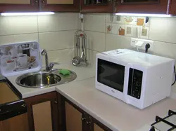 Installing a microwave in the kitchen photo