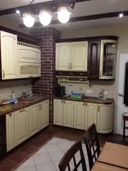 Photo of a kitchen with a ventilation duct in the corner photo
