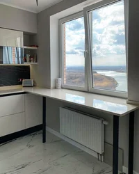 Kitchens with a table on the windowsill photo