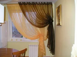 Curtains for the kitchen in the interior of the apartment