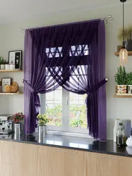 Curtains for the kitchen in the interior of the apartment