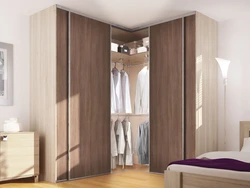 Corner wardrobe in the bedroom photo design ideas