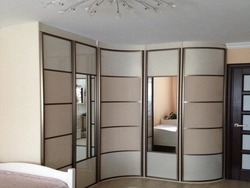 Corner wardrobe in the bedroom photo design ideas