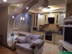 Arches in the interior of the living room with kitchen photo