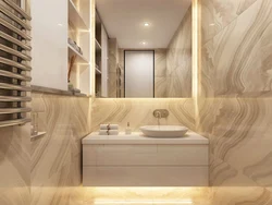 Bath design with marble tiles and wood