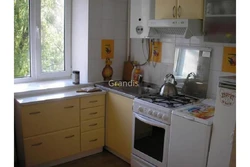 Kitchen design 6 sq m in Khrushchev with a gas water heater