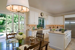 Kitchen design in a country house with access to the terrace
