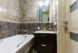 Small bathroom in marble tiles photo
