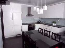 Kitchen photo with dark floor photo