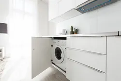 Built-in washing machine in the kitchen photo