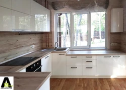Bright corner kitchens with window photo