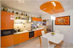 Gray wallpaper and orange kitchen photo