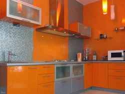 Gray wallpaper and orange kitchen photo